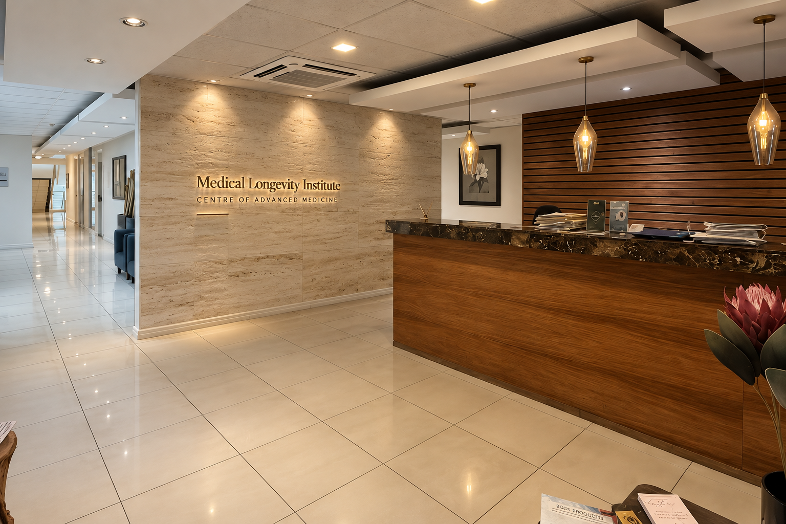 Medical Longevity Institute reception at the Centre of Advanced Medicine, with travertine signage wall and timber desk